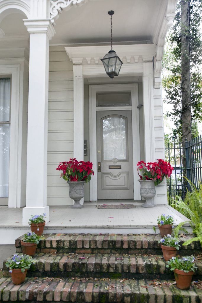 old southern mansion with flowers on doorstep